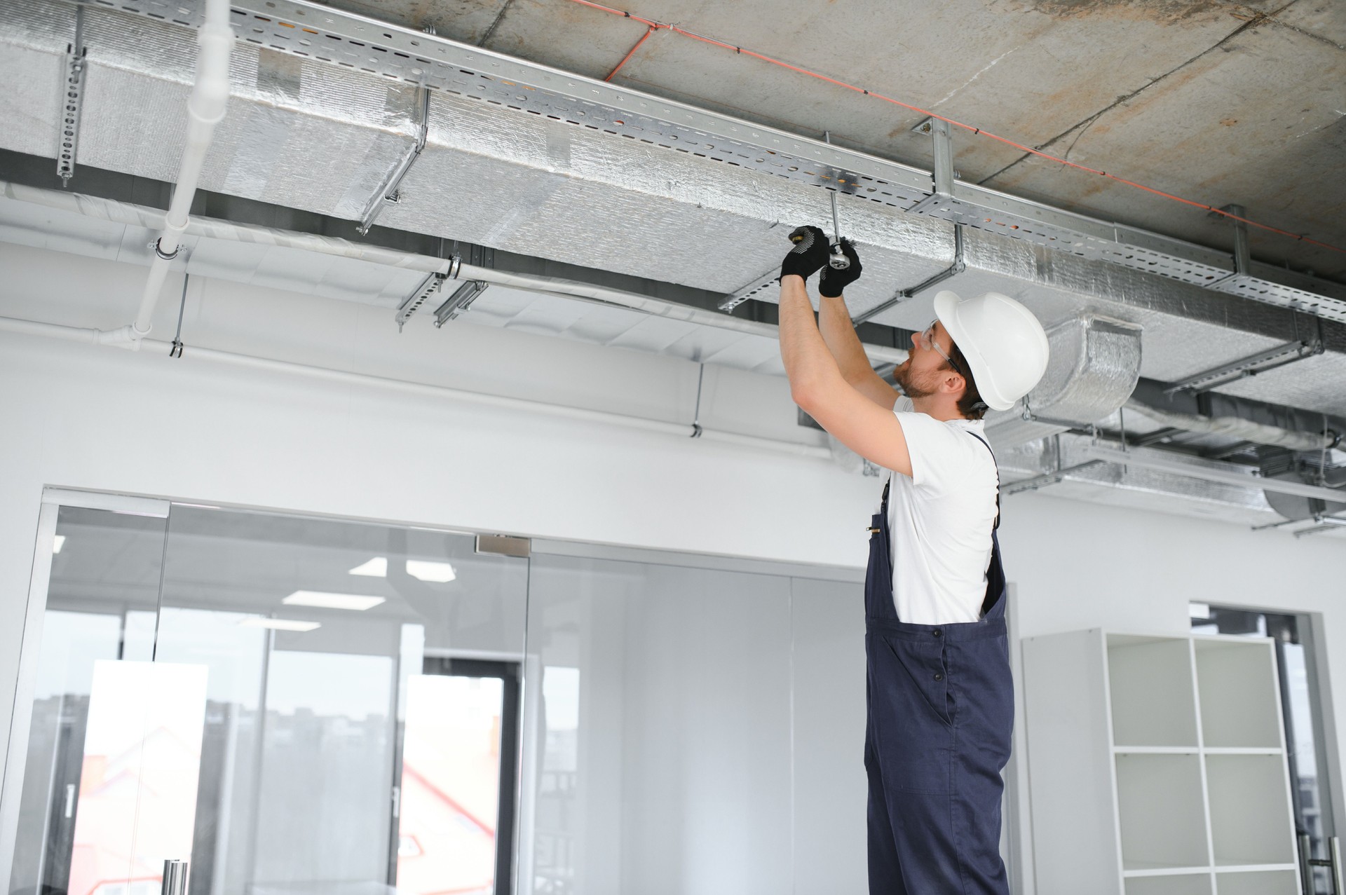 ventilation system installation and repair service. hvac technician at work. banner copy space